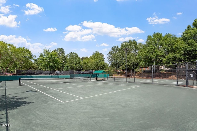 10511 Rosegate Ct Unit 103, Raleigh, NC 27617 - view of tennis court with view of wooded area