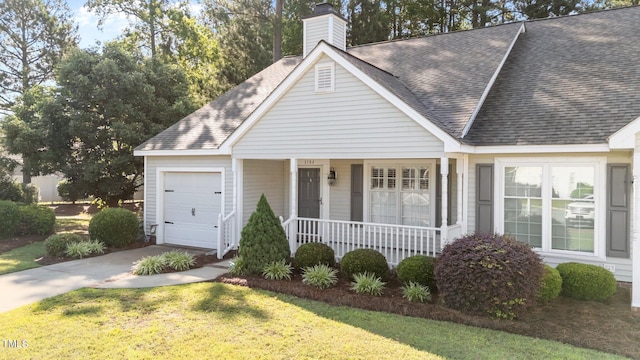 3782 Loblolly Dr # 5, Rocky Mount, NC 27804 - view of front facade featuring a porch, an attached garage, roof with shingles, concrete driveway, and a chimney