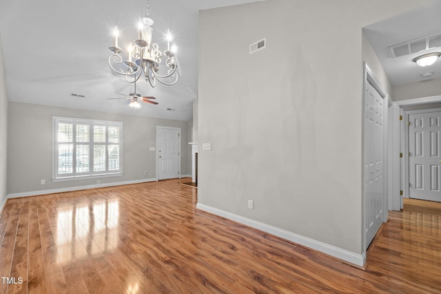 3782 Loblolly Dr # 5, Rocky Mount, NC 27804 - unfurnished living room featuring wood finished floors, a ceiling fan, and a chandelier