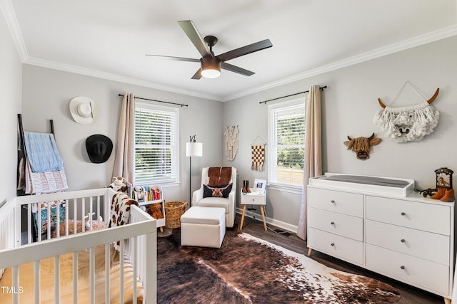 224 Grameta Ln, Lillington, NC 27546 - bedroom with ornamental molding, a nursery area, multiple windows, wood finished floors, and a ceiling fan