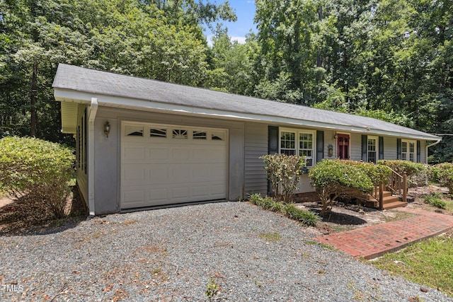 18 Red Pine Rd, Chapel Hill, NC 27516 - ranch-style home featuring an attached garage and gravel driveway