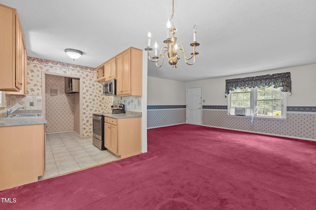 18 Red Pine Rd, Chapel Hill, NC 27516 - kitchen featuring appliances with stainless steel finishes, wallpapered walls, light colored carpet, light brown cabinetry, and a chandelier