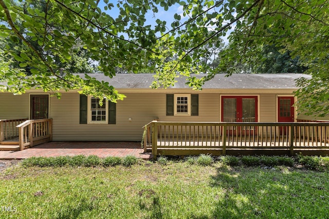 18 Red Pine Rd, Chapel Hill, NC 27516 - rear view of house featuring french doors, a wooden deck, and a yard