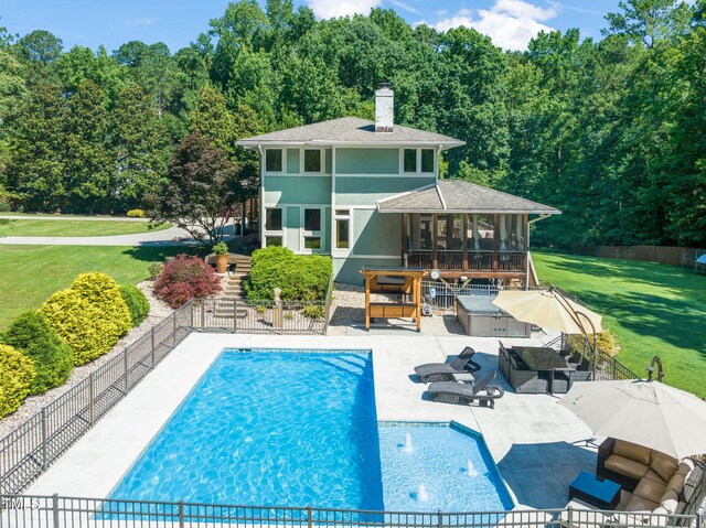 1209 Ravens Point Cir, Raleigh, NC 27614 - back of house featuring a sunroom, stucco siding, a fenced backyard, a patio area, and a chimney