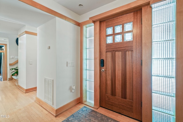 1209 Ravens Point Cir, Raleigh, NC 27614 - foyer with baseboards and light wood finished floors