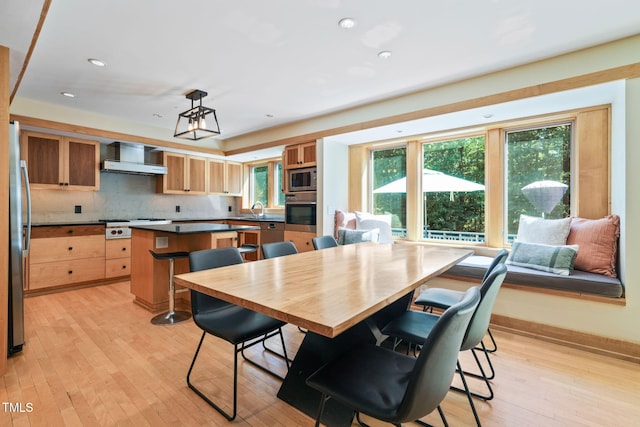 1209 Ravens Point Cir, Raleigh, NC 27614 - dining space with light wood finished floors and recessed lighting