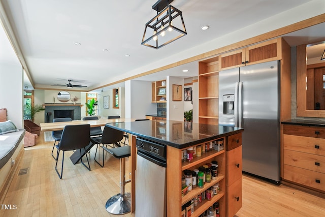 1209 Ravens Point Cir, Raleigh, NC 27614 - kitchen with open shelves, stainless steel refrigerator with ice dispenser, light wood-style floors, a kitchen island, and a ceiling fan