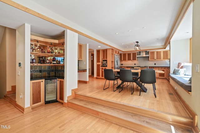 1209 Ravens Point Cir, Raleigh, NC 27614 - dining room with beverage cooler, light wood-style flooring, a bar, and recessed lighting
