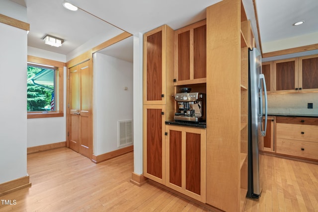 1209 Ravens Point Cir, Raleigh, NC 27614 - kitchen featuring light wood finished floors, stainless steel fridge, recessed lighting, and dark countertops