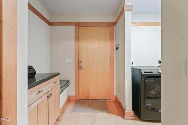 1209 Ravens Point Cir, Raleigh, NC 27614 - laundry room featuring washer / dryer and light wood-type flooring