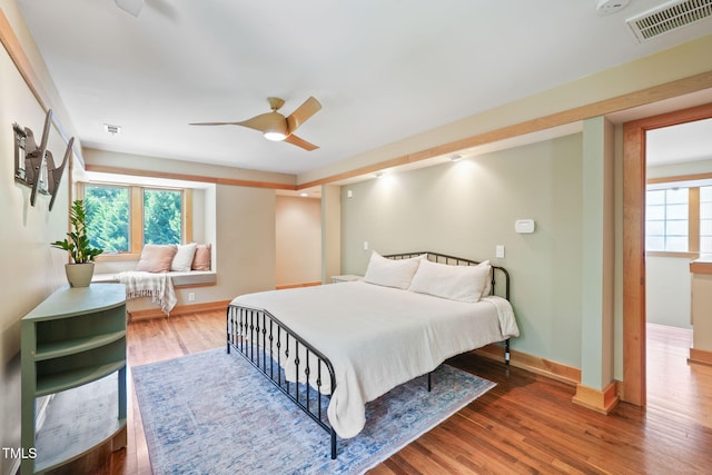 1209 Ravens Point Cir, Raleigh, NC 27614 - bedroom with wood finished floors and a ceiling fan