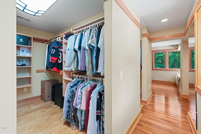 1209 Ravens Point Cir, Raleigh, NC 27614 - spacious closet with wood finished floors