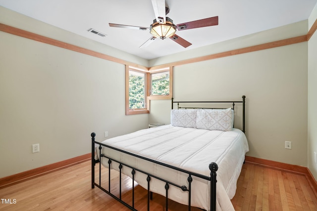 1209 Ravens Point Cir, Raleigh, NC 27614 - bedroom with light wood finished floors and ceiling fan