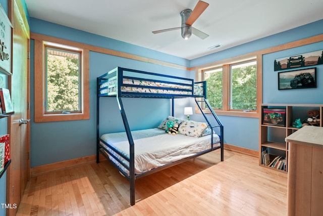 1209 Ravens Point Cir, Raleigh, NC 27614 - bedroom featuring hardwood / wood-style flooring, multiple windows, and ceiling fan
