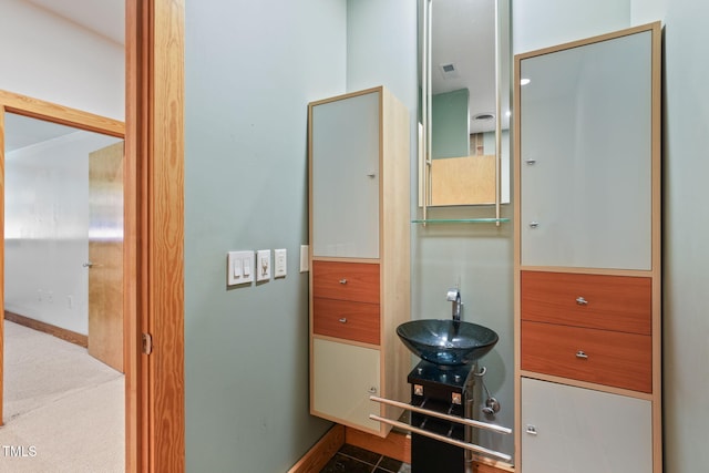 1209 Ravens Point Cir, Raleigh, NC 27614 - bathroom with baseboards and a sink
