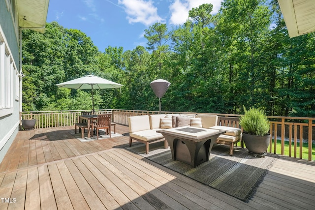 1209 Ravens Point Cir, Raleigh, NC 27614 - wooden terrace with an outdoor living space with a fire pit, outdoor dining area, and view of wooded area