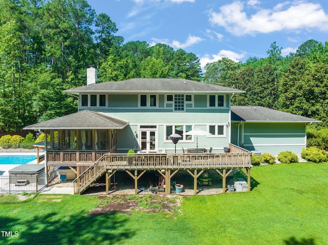 1209 Ravens Point Cir, Raleigh, NC 27614 - rear view of house with a chimney, an outdoor pool, a deck, a sunroom, and a shingled roof