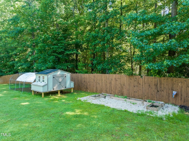 1209 Ravens Point Cir, Raleigh, NC 27614 - fenced backyard with an outbuilding and a vegetable garden