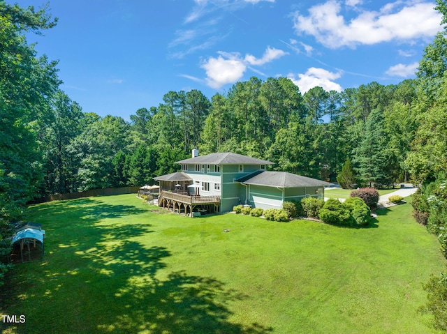 1209 Ravens Point Cir, Raleigh, NC 27614 - back of house featuring a wooden deck and a forest view