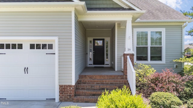 16 Woodglen Dr, Clayton, NC 27527 - entrance to property with a garage and a shingled roof