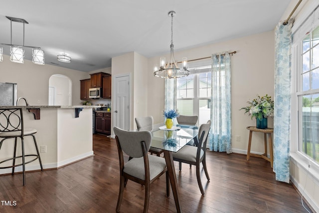 16 Woodglen Dr, Clayton, NC 27527 - dining area featuring a chandelier, healthy amount of natural light, and dark wood-type flooring