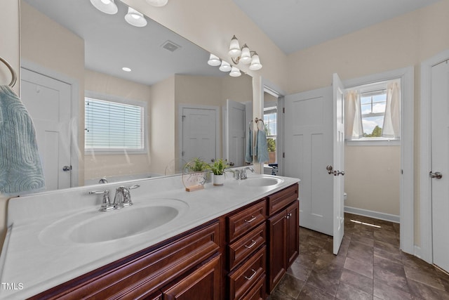 16 Woodglen Dr, Clayton, NC 27527 - bathroom featuring double vanity and toilet