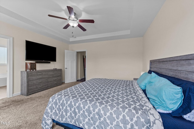 16 Woodglen Dr, Clayton, NC 27527 - carpeted bedroom with a tray ceiling and ceiling fan