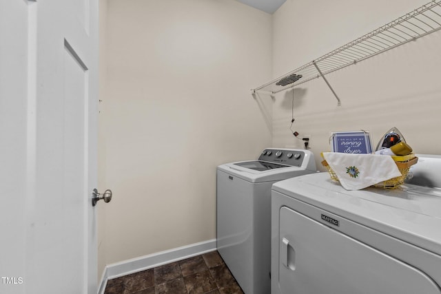 16 Woodglen Dr, Clayton, NC 27527 - washroom featuring washing machine and dryer and dark stone finish floors