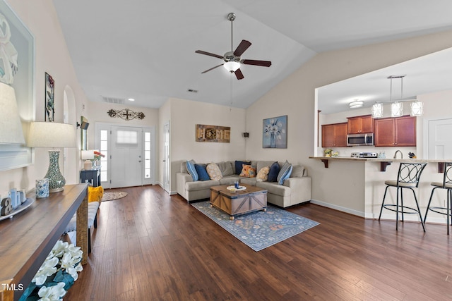 16 Woodglen Dr, Clayton, NC 27527 - living area featuring vaulted ceiling, a ceiling fan, and dark wood-style floors