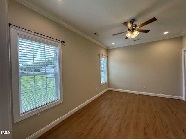 3005 Condor Ct, Deep Run, NC 28525 - unfurnished room with plenty of natural light, wood finished floors, a ceiling fan, ornamental molding, and recessed lighting