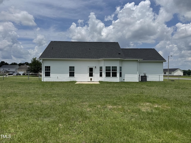 3005 Condor Ct, Deep Run, NC 28525 - rear view of house with a lawn, roof with shingles, and a patio