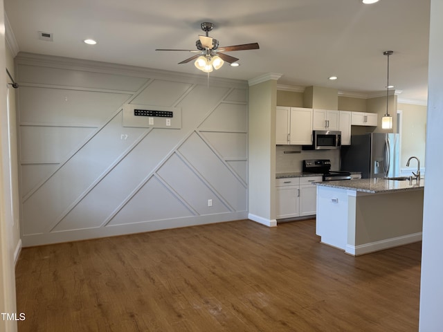 3005 Condor Ct, Deep Run, NC 28525 - kitchen featuring stainless steel appliances, a decorative wall, ornamental molding, white cabinets, and ceiling fan
