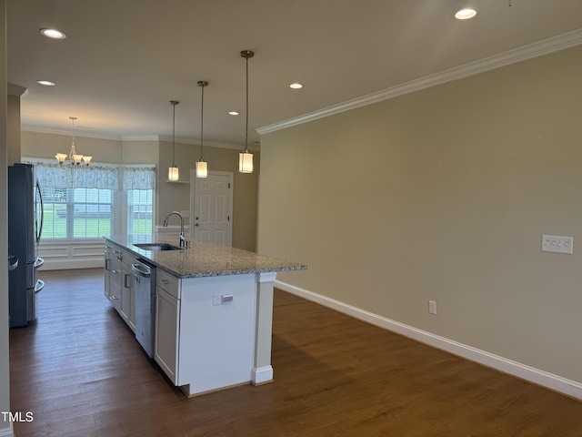 3005 Condor Ct, Deep Run, NC 28525 - kitchen with freestanding refrigerator, dark wood-style flooring, a center island with sink, a chandelier, and light stone countertops