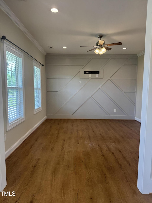 3005 Condor Ct, Deep Run, NC 28525 - spare room with crown molding, wood finished floors, a ceiling fan, recessed lighting, and a decorative wall