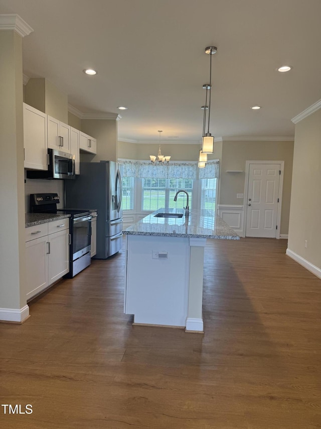 3005 Condor Ct, Deep Run, NC 28525 - kitchen with stainless steel appliances, ornamental molding, light stone countertops, white cabinets, and recessed lighting