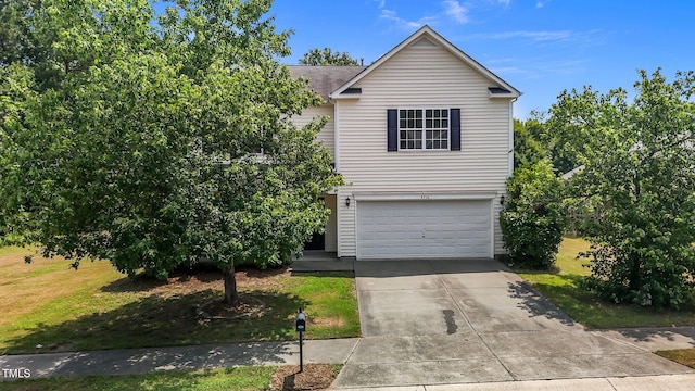 4716 Miller Dr, Durham, NC 27704 - view of front of home with driveway, a garage, and a front yard