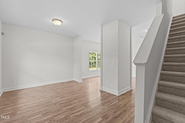 4716 Miller Dr, Durham, NC 27704 - stairs with wood finished floors and baseboards