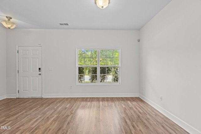 4716 Miller Dr, Durham, NC 27704 - empty room with light wood-style floors and baseboards