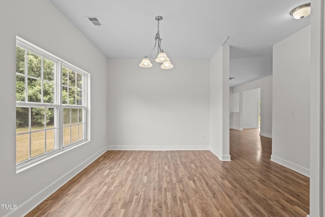 4716 Miller Dr, Durham, NC 27704 - empty room with wood finished floors and a chandelier