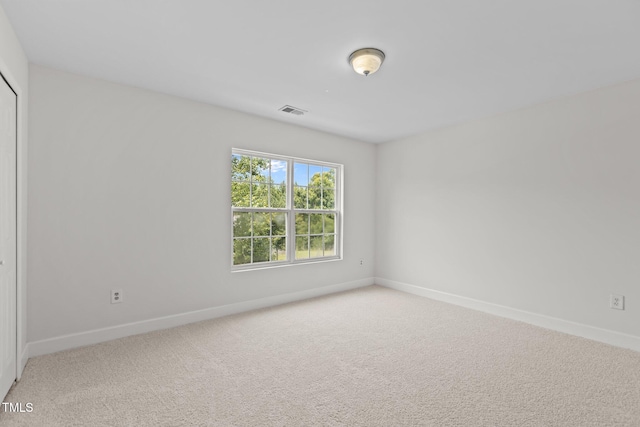 4716 Miller Dr, Durham, NC 27704 - unfurnished room with baseboards and light carpet