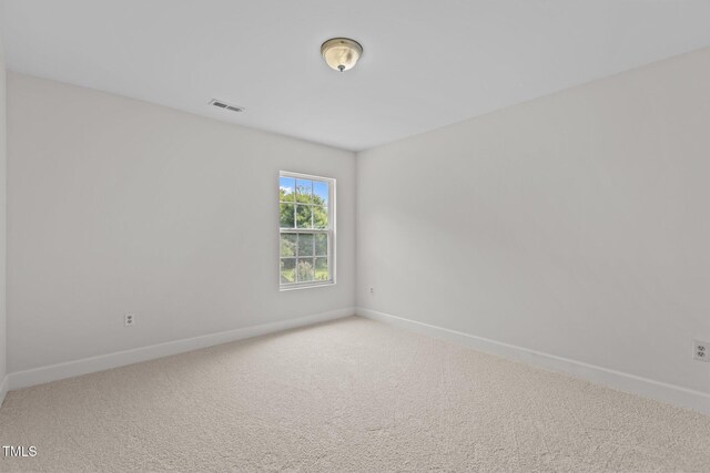 4716 Miller Dr, Durham, NC 27704 - carpeted empty room featuring baseboards