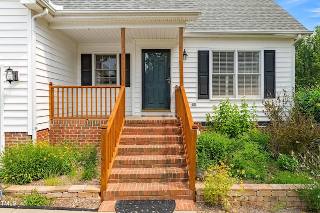 741 Rockville Rd, Wake Forest, NC 27587 - view of exterior entry featuring a shingled roof
