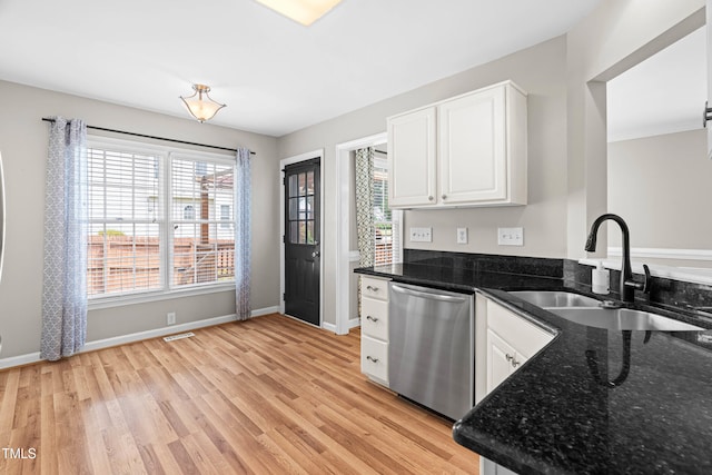 741 Rockville Rd, Wake Forest, NC 27587 - kitchen with stainless steel dishwasher, white cabinetry, and light wood-type flooring