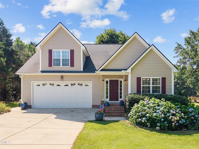 545 Olivia Way, Selma, NC 27576 - traditional-style house with a front lawn, driveway, and a shingled roof