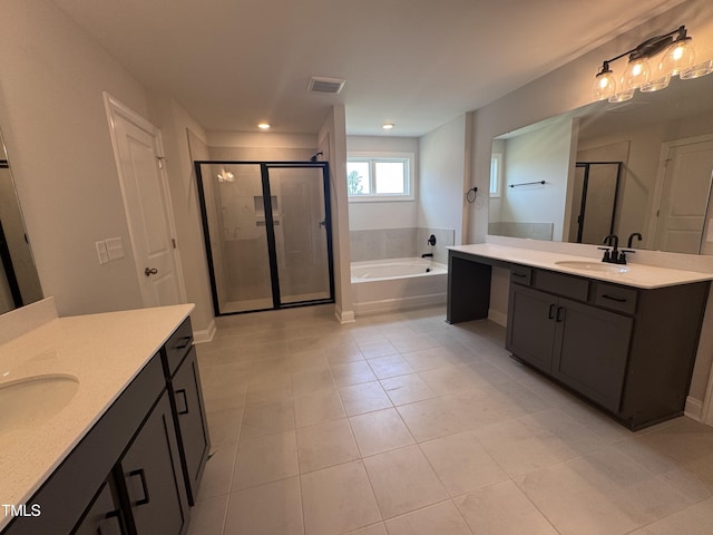 3509 Bailey Lake Dr, Fuquay Varina, NC 27526 - bathroom featuring two vanities, a stall shower, tile patterned flooring, a bath, and recessed lighting