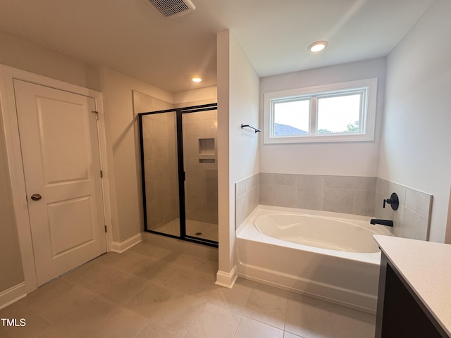 3509 Bailey Lake Dr, Fuquay Varina, NC 27526 - bathroom with a bath, a shower stall, tile patterned flooring, vanity, and recessed lighting