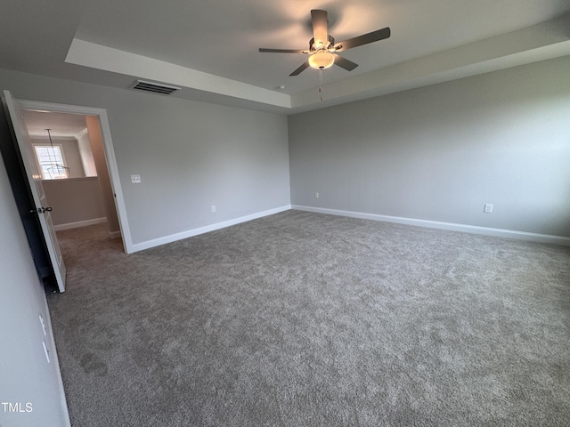 3509 Bailey Lake Dr, Fuquay Varina, NC 27526 - unfurnished room with ceiling fan, carpet flooring, and a tray ceiling