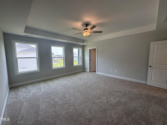 3509 Bailey Lake Dr, Fuquay Varina, NC 27526 - carpeted empty room with a raised ceiling and ceiling fan