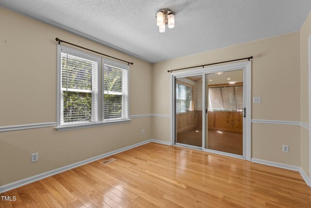 276 Sagamore Dr, Louisburg, NC 27549 - spare room with light wood-style floors and a textured ceiling