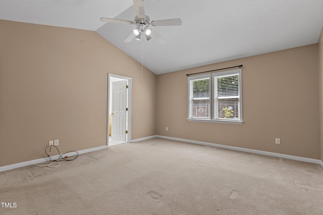 276 Sagamore Dr, Louisburg, NC 27549 - empty room featuring carpet, a ceiling fan, and vaulted ceiling